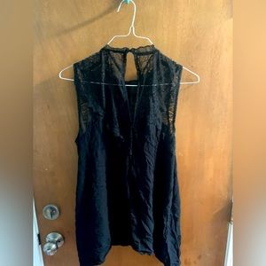 Black sleeveless blouse with lace detail